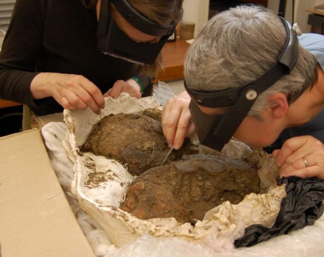 Conservators And Helmet Fragments Aspect Ratio 650 517