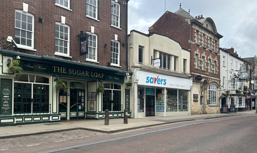 A row of shops and a pub