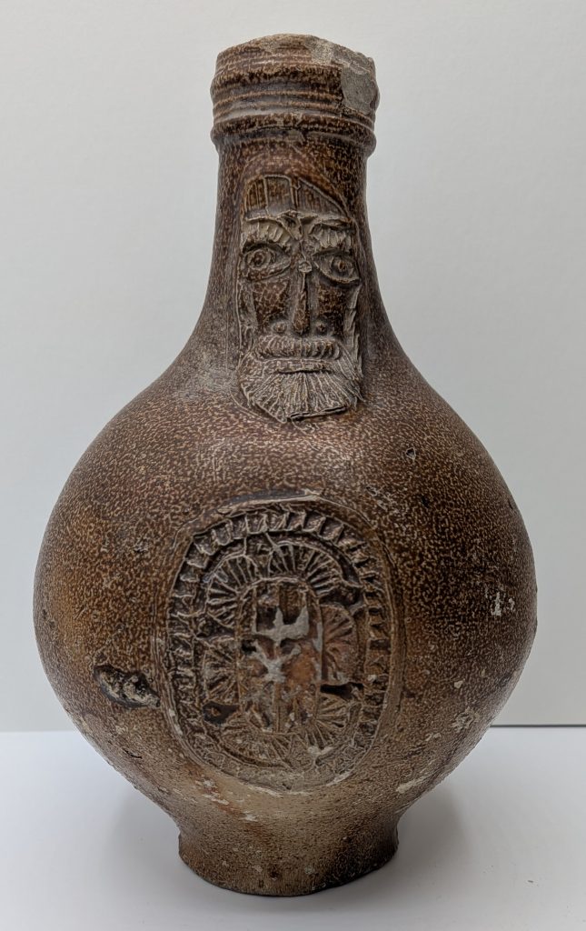 Bellarmine Jug with long neck and stamped decoration on the body
